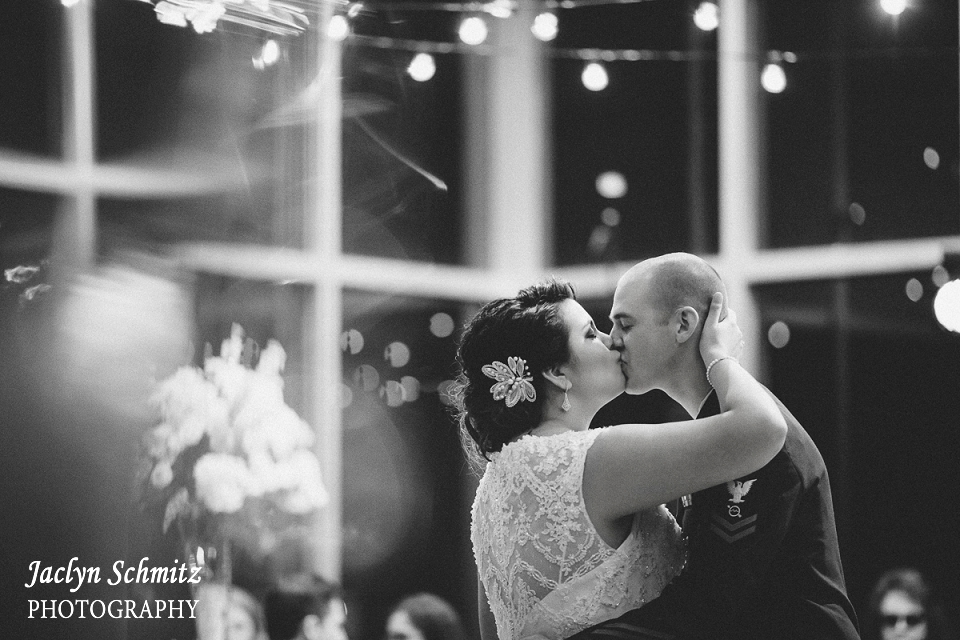 coast guard groom and bride in lace first dance hanging light strands